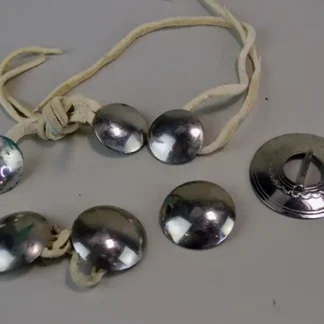 Mixed Group Lot- Conchos & Brooch with six German silver conchos and a hand‑stamped 1.75" brooch—five on leather lacing for easy crafting.