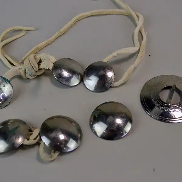 Mixed Group Lot- Conchos & Brooch with six German silver conchos and a hand‑stamped 1.75" brooch—five on leather lacing for easy crafting.