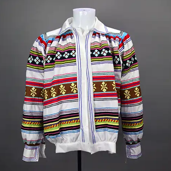 Vintage Jacket- White Seminole with early 20th‑century patchwork, bat‑wing sleeves, interior stitching, and medium–large sizing. ONE OF A KIND.