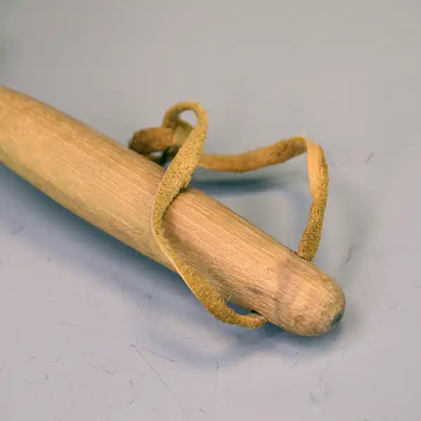 Vintage handcrafted Rattle- Horn with red painted accents and deerskin lacing. Perfect for collections, displays, and cultural gatherings. Approx. 9.5". pictured here is the leather lacing at the bottom of the handle.