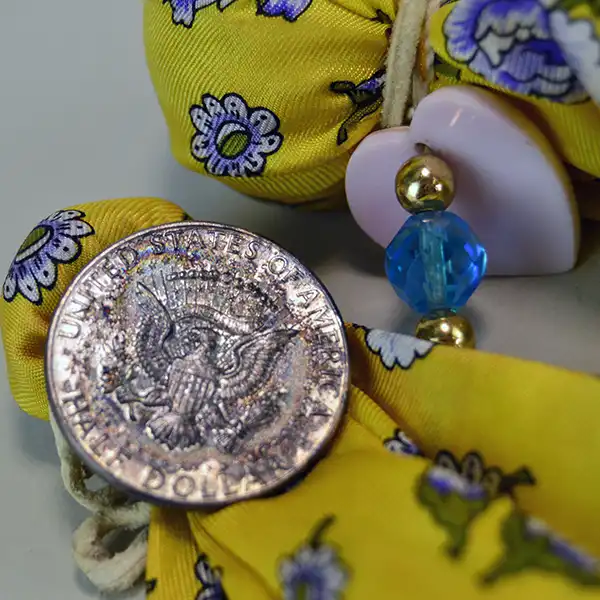 Scarves- Silk Yellow Floral with artisan beadwork, a pink concho heart, turquoise AB beads, and a vintage 1964 Half Dollar accent. One of a Kind. Pictured here is a closer view of the accents.
