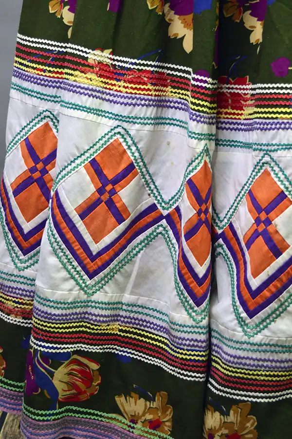 Vintage Skirt & Blouse- Seminole set with patchwork and geometric banding, rickrack trim, and classic strip‑piecing. One of a Kind. more of the patchwork design.