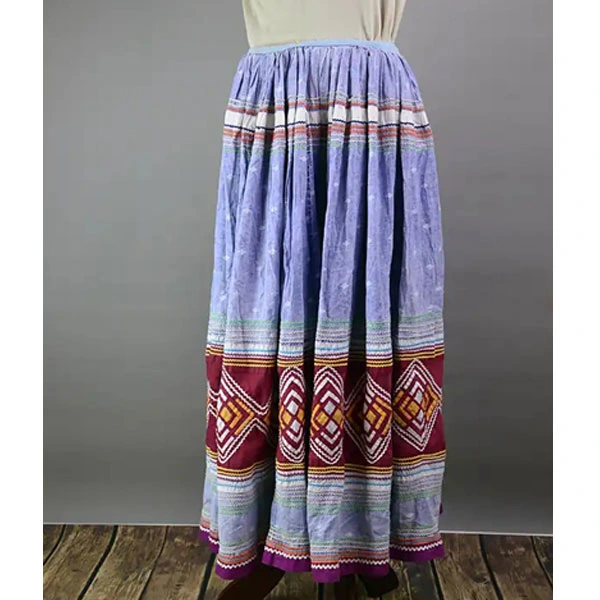 Vintage calico Seminole‑style patchwork skirt with multicolor rickrack, vibrant piecework, and traditional craftsmanship; shows gentle wear. One of a kind.