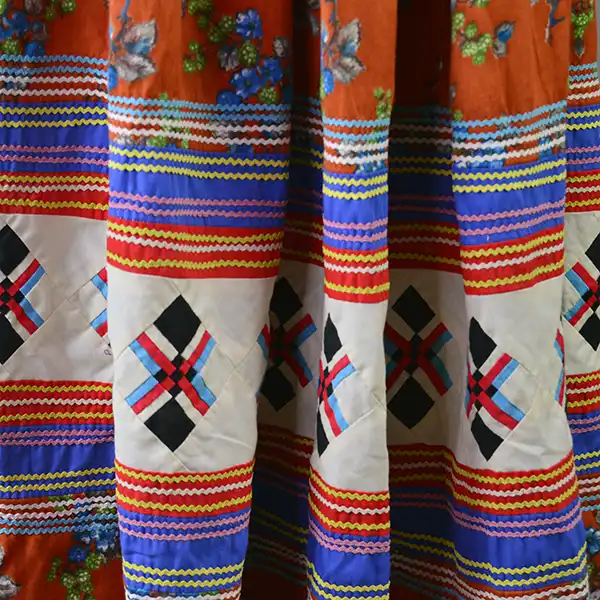 Vintage Skirt- Floral Seminole Style patchwork skirt with multicolor rickrack, bold piecework, and traditional craftsmanship; shows gentle wear. The colorful Ric rack and the path work design.