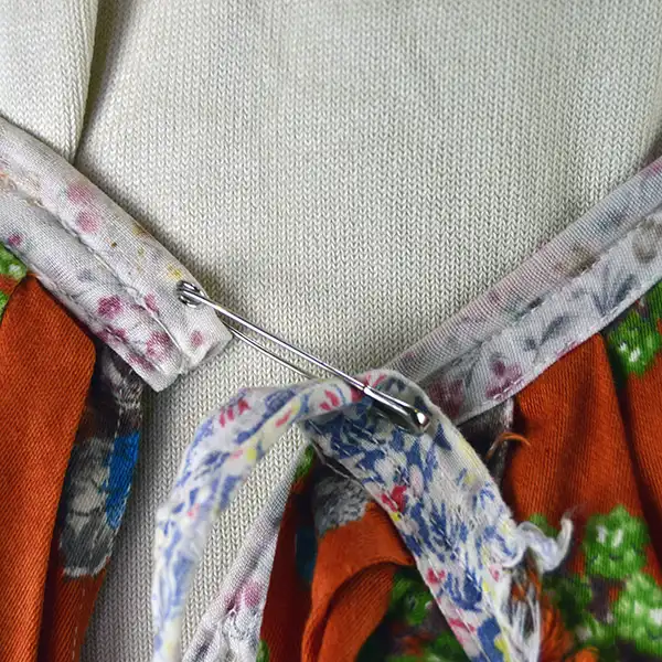 Vintage Skirt- Floral Seminole Style patchwork skirt with multicolor rickrack, bold piecework, and traditional craftsmanship; shows gentle wear. The safety pin for the skirt closure.