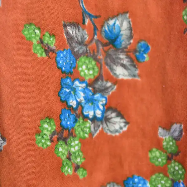 Vintage Skirt- Floral Seminole Style patchwork skirt with multicolor rickrack, bold piecework, and traditional craftsmanship; shows gentle wear. The floral design with the red backround.