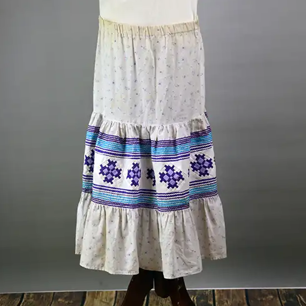 Vintage Skirt- Floral White Seminole with purple patchwork, turquoise rickrack, stretched elastic waist. Estimated to be a girls size XL or a women's XS.