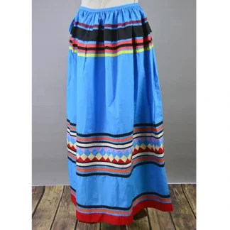 Vintage Skirt- Light Blue Seminole with colorful patchwork and multicolor ribbon work, showing gentle wear and traditional Seminole craftsmanship.