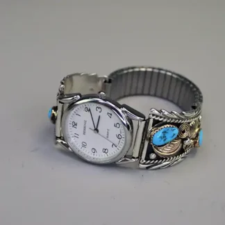 Vintage Behrouz quartz watch with a turquoise band, stainless steel case, and gold‑plated accents. A precise, collectible 1970s–1980s piece. One of a kind.
