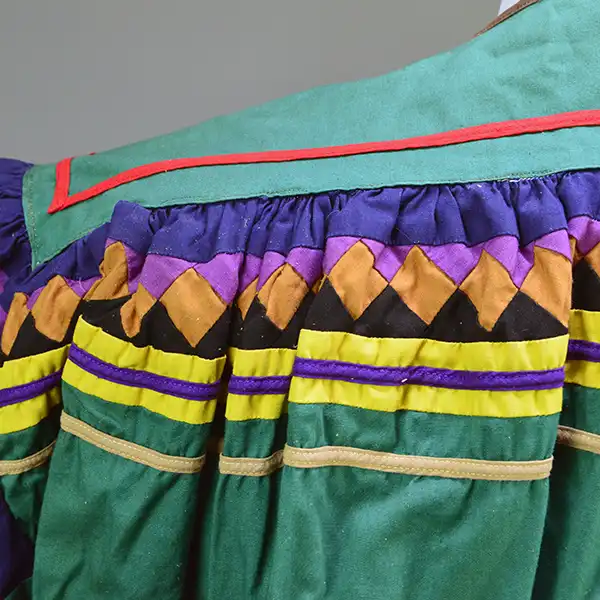 Old Style Green Seminole Jacket. Patchwork close up.