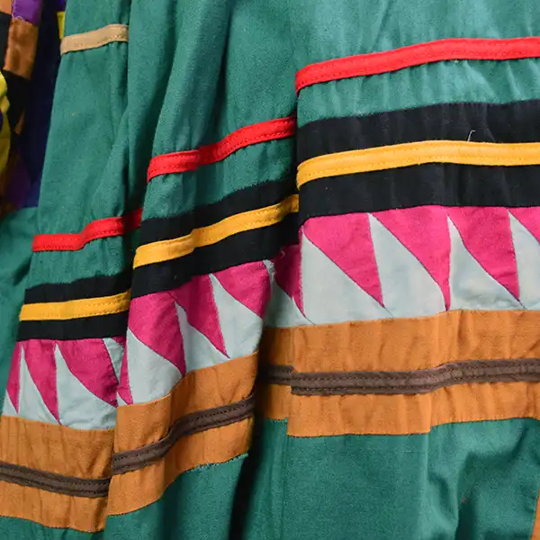 Old Style Green Seminole Jacket. Patchwork close up.