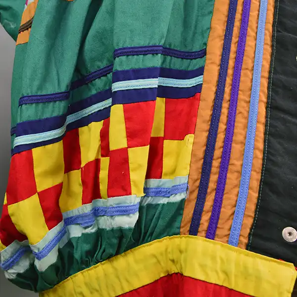 Old Style Green Seminole Jacket. Patchwork close up.