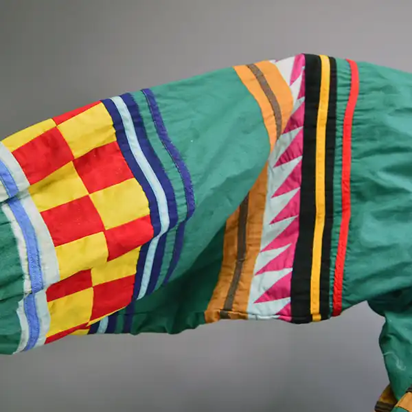 Old Style Green Seminole Jacket. Patchwork close up.
