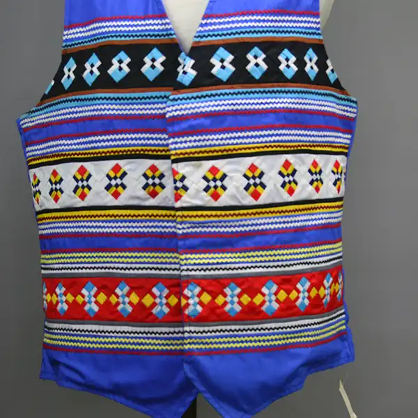 Seminole style vest royal blue with three rows of patchwork. Close up of front