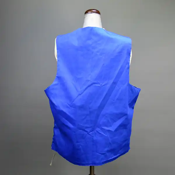 Seminole style vest royal blue with three rows of patchwork. Back side.
