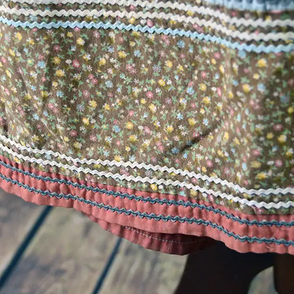 Vintage brown calico Seminole skirt hem close up